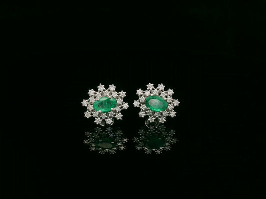 18K white gold emerald and diamond stud earrings with oval emerald center by Emirates Diamonds