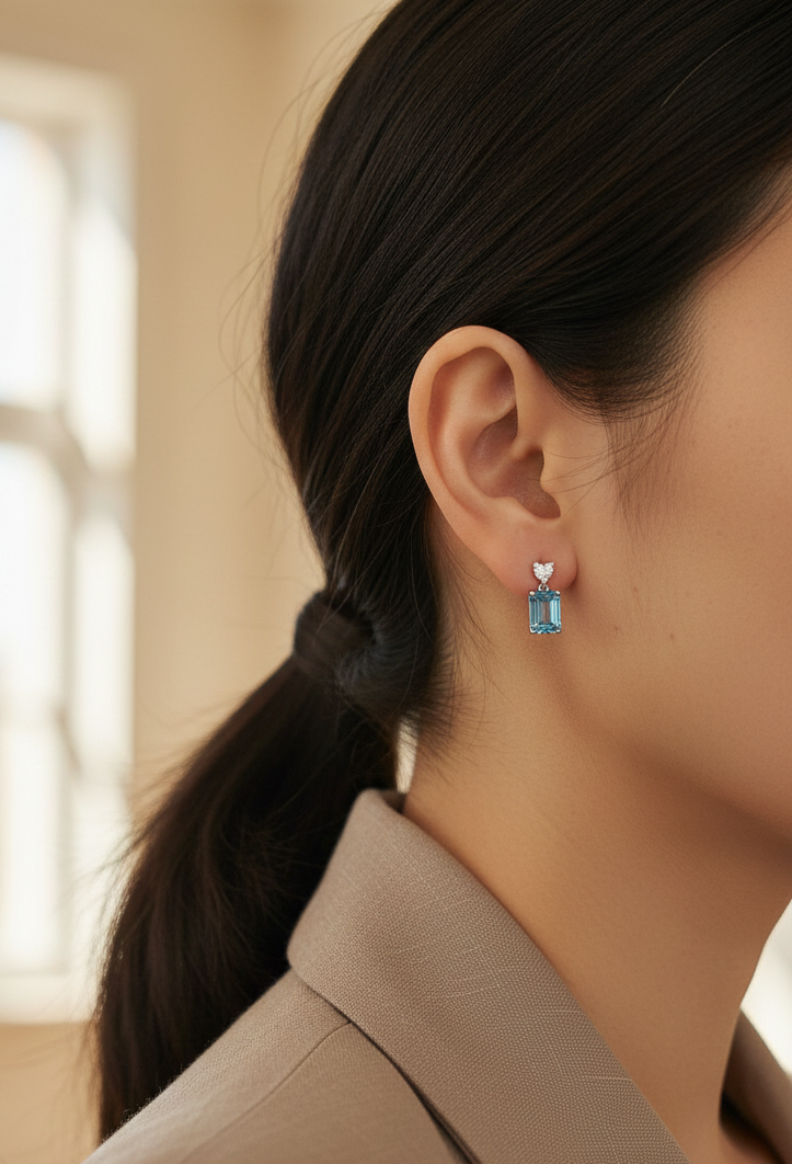 Swiss blue topaz and diamond stud earrings in 18K white gold by Emirates Diamonds.