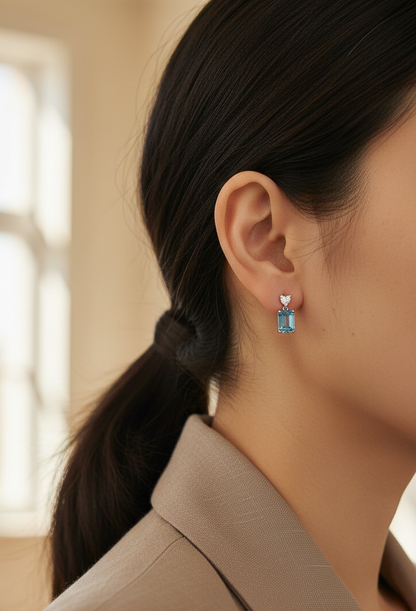 Swiss blue topaz and diamond stud earrings in 18K white gold by Emirates Diamonds.