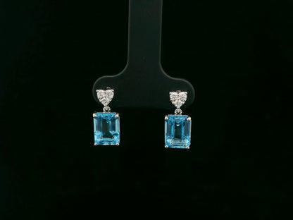 Swiss blue topaz and diamond stud earrings in 18K white gold by Emirates Diamonds.