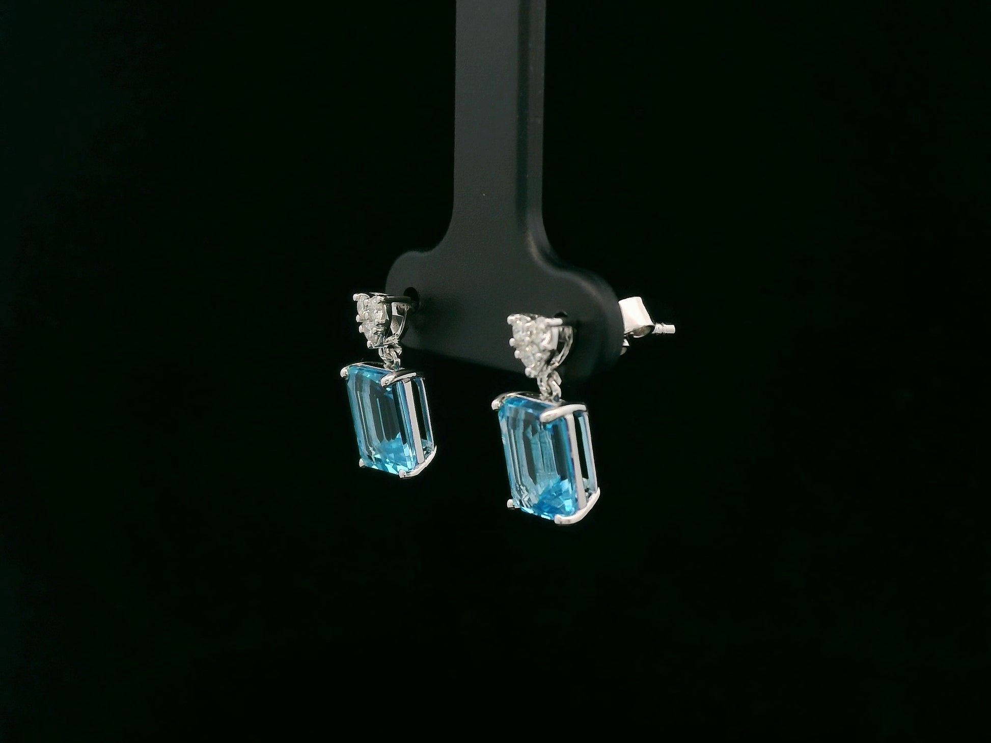 Swiss blue topaz and diamond stud earrings in 18K white gold by Emirates Diamonds.