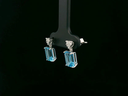 Swiss blue topaz and diamond stud earrings in 18K white gold by Emirates Diamonds.