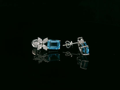 18K white gold Swiss blue topaz and diamond stud earrings with  diamond floral design – Emirates Diamonds