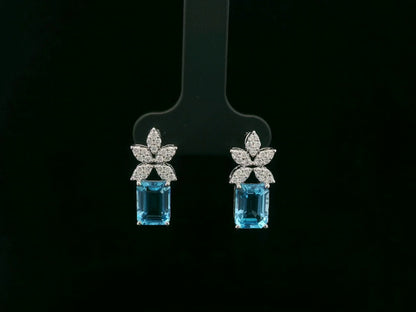 18K white gold Swiss blue topaz and diamond stud earrings with  diamond floral design – Emirates Diamonds