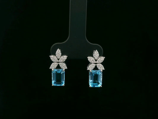 18K white gold Swiss blue topaz and diamond stud earrings with  diamond floral design – Emirates Diamonds