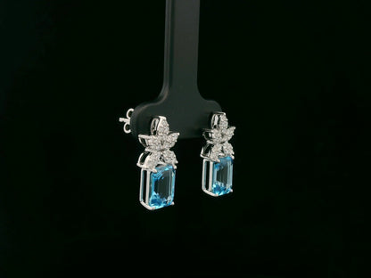 18K white gold Swiss blue topaz and diamond stud earrings with  diamond floral design – Emirates Diamonds