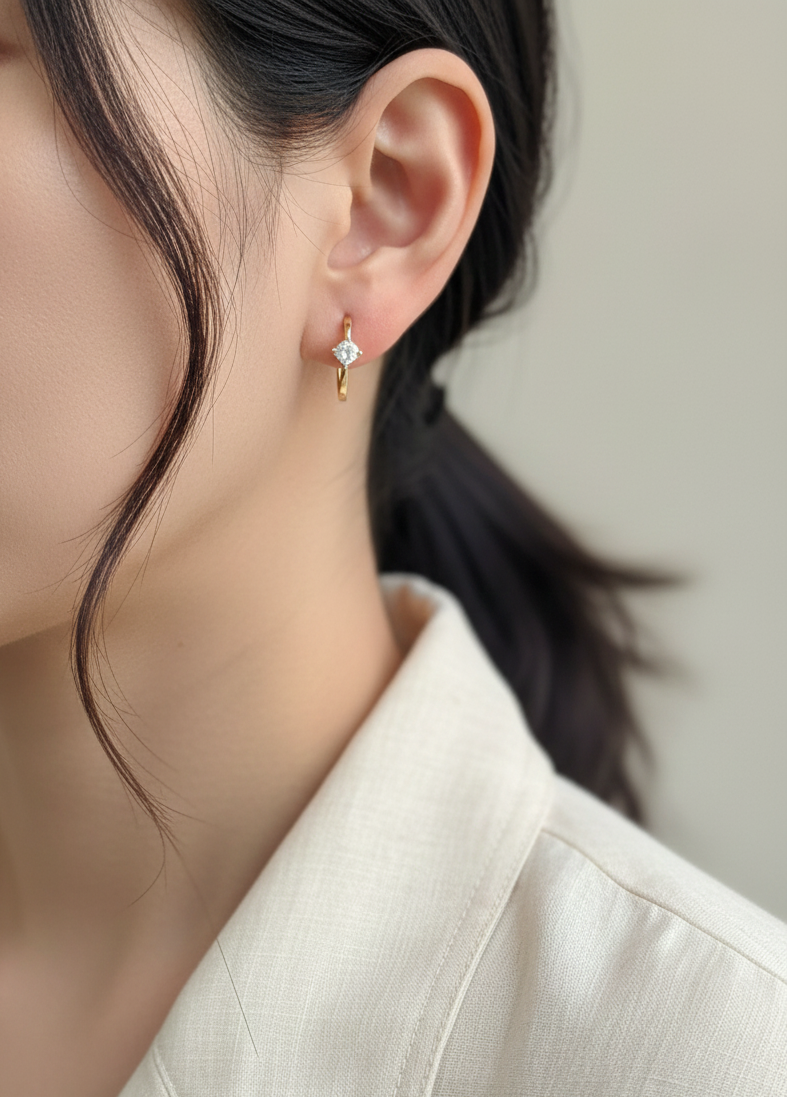 18K yellow gold diamond hoop earrings with round brilliant-cut diamonds, 0.63 carat total weight, fine jewelry by Emirates Diamonds.