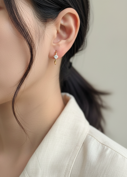 18K yellow gold diamond hoop earrings with round brilliant-cut diamonds, 0.63 carat total weight, fine jewelry by Emirates Diamonds.