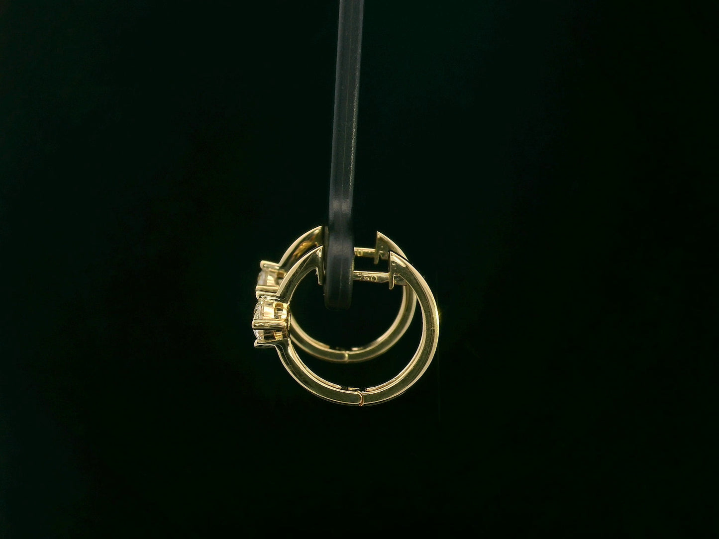18K yellow gold diamond hoop earrings with round brilliant-cut diamonds, 0.63 carat total weight, fine jewelry by Emirates Diamonds.