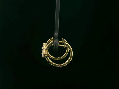 18K yellow gold diamond hoop earrings with round brilliant-cut diamonds, 0.63 carat total weight, fine jewelry by Emirates Diamonds.