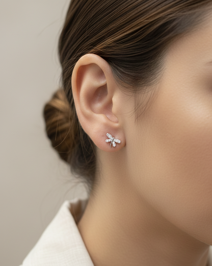 18K white gold diamond dragonfly stud earrings with pavé-set round brilliant diamonds by Emirates Diamonds