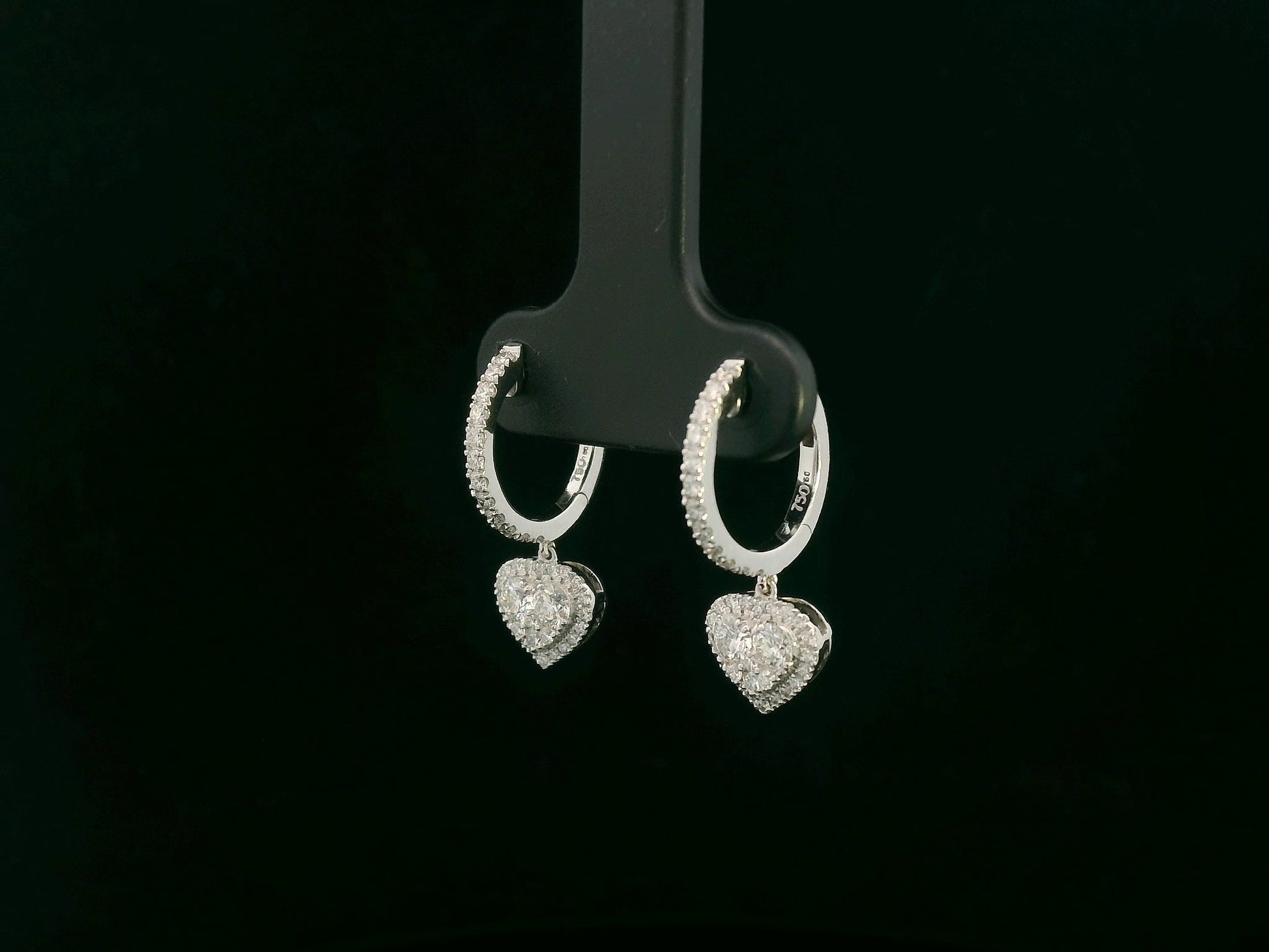 18K white gold diamond heart drop hoop earrings with pavé-set diamonds, luxury fine jewelry by Emirates Diamonds.