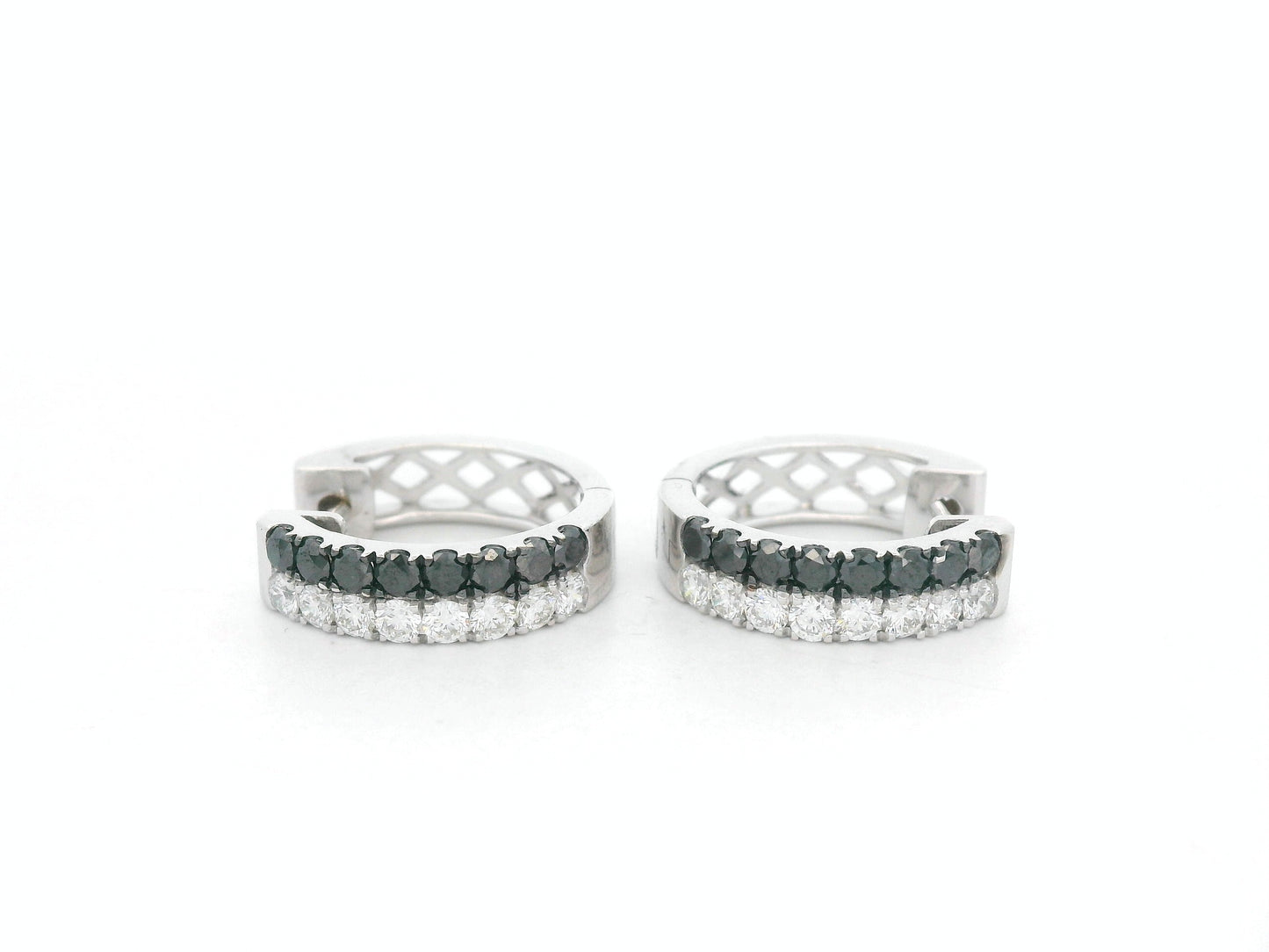 18K white gold hoop earrings with white and black pavé-set diamonds, modern luxury design by Emirates Diamonds.