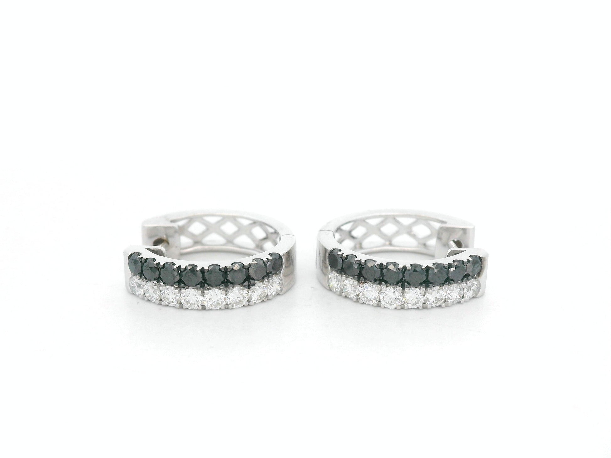 18K white gold hoop earrings with white and black pavé-set diamonds, modern luxury design by Emirates Diamonds.