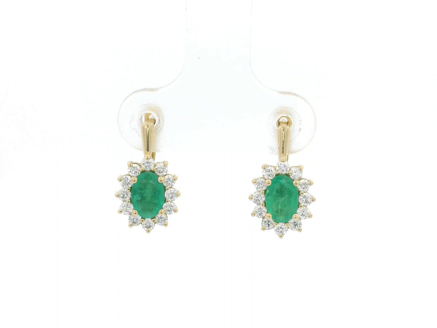18K yellow gold emerald and diamond halo earrings featuring oval-cut emeralds surrounded by brilliant diamonds by Emirates Diamonds.