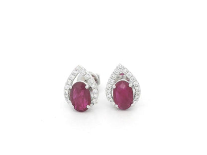 18K white gold ruby and diamond stud earrings featuring oval-cut rubies with diamond accents by Emirates Diamonds.