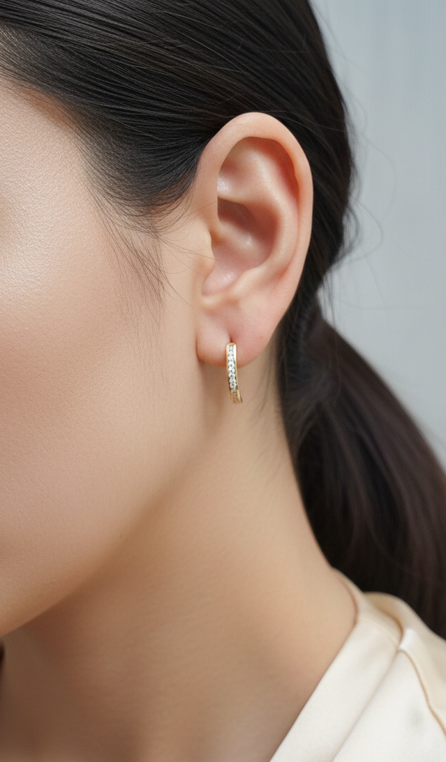 Diamond half hoop earrings with 0.31ct round diamonds set in 18K yellow gold by Emirates Diamonds