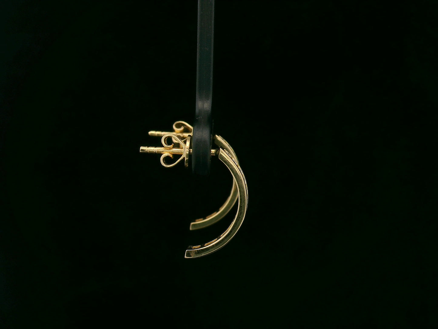 Diamond half hoop earrings with 0.31ct round diamonds set in 18K yellow gold by Emirates Diamonds