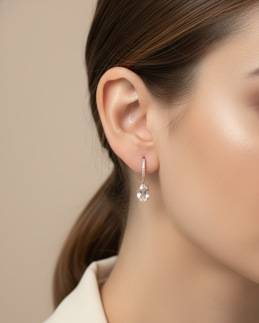 18K rose gold drop earrings featuring oval-cut morganite gemstones with diamond-accented hoops by Emirates Diamonds.