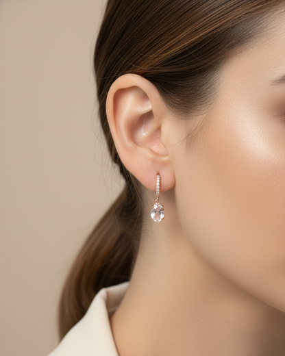 18K rose gold drop earrings featuring oval-cut morganite gemstones with diamond-accented hoops by Emirates Diamonds.