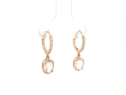 18K rose gold drop earrings featuring oval-cut morganite gemstones with diamond-accented hoops by Emirates Diamonds.