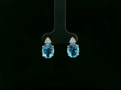 18K white gold stud earrings with oval Swiss Blue Topaz and  diamond accents