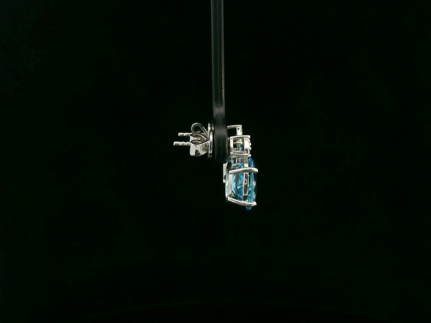 18K white gold stud earrings with oval Swiss Blue Topaz and  diamond accents
