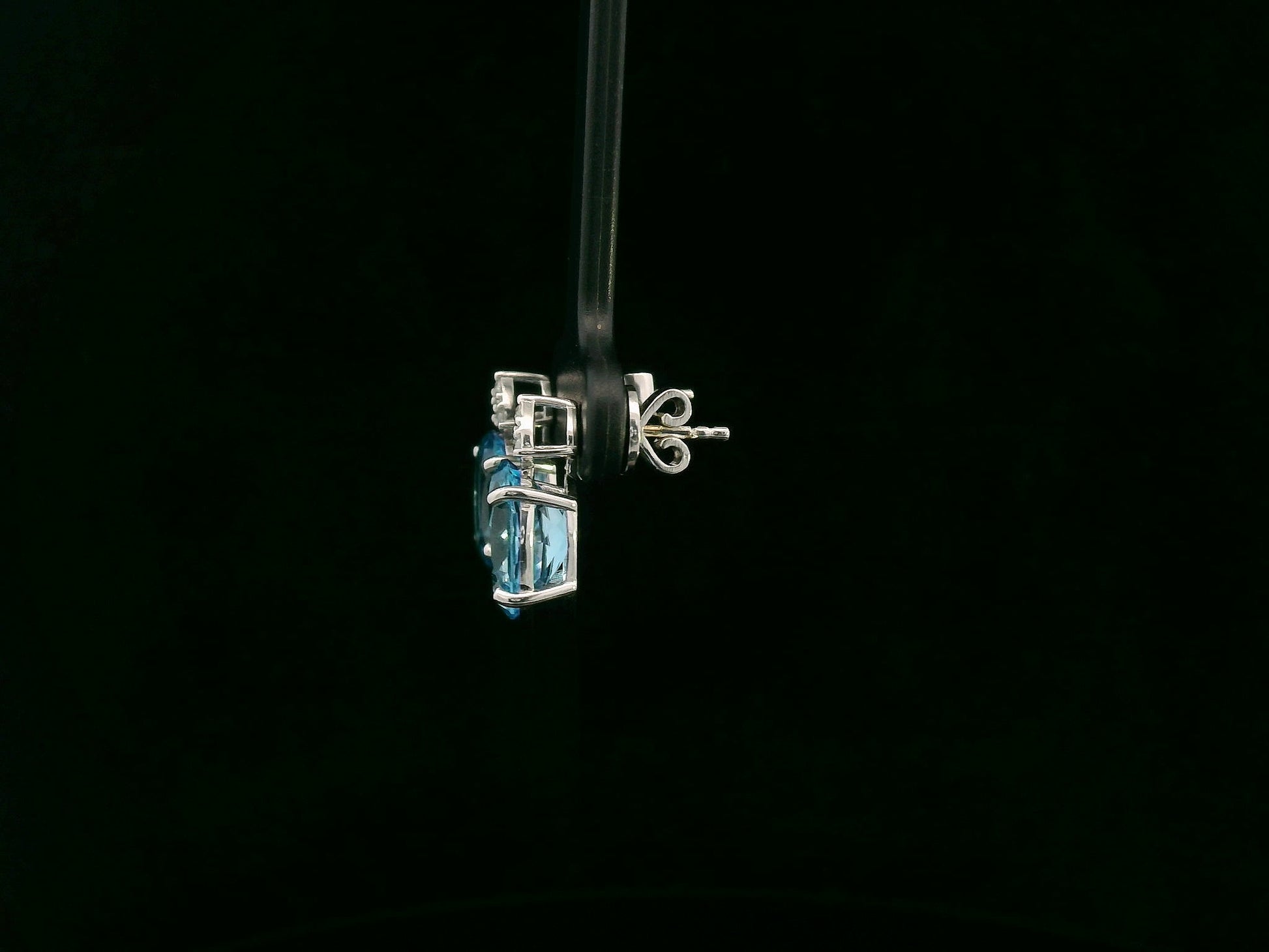 18K white gold stud earrings with oval Swiss Blue Topaz and  diamond accents