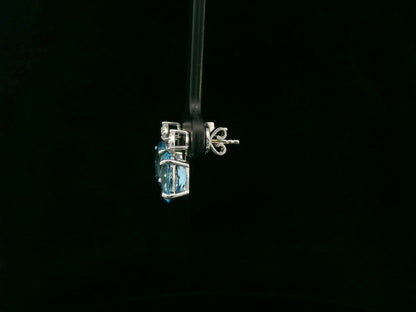 18K white gold stud earrings with oval Swiss Blue Topaz and  diamond accents