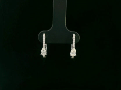 18K white gold pear diamond huggie earrings with center-set pear diamonds – Emirates Diamonds