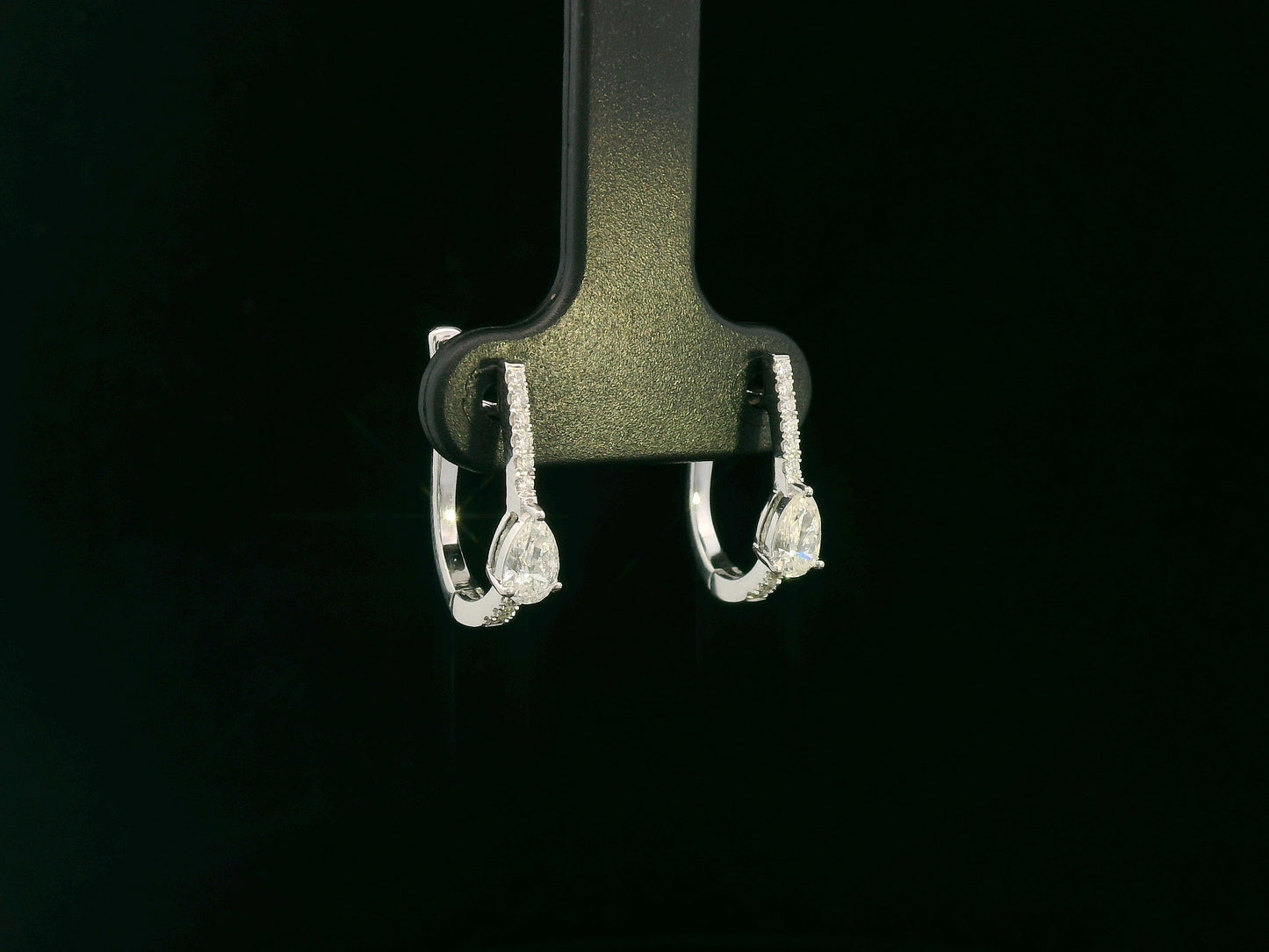 18K white gold pear diamond huggie earrings with center-set pear diamonds – Emirates Diamonds