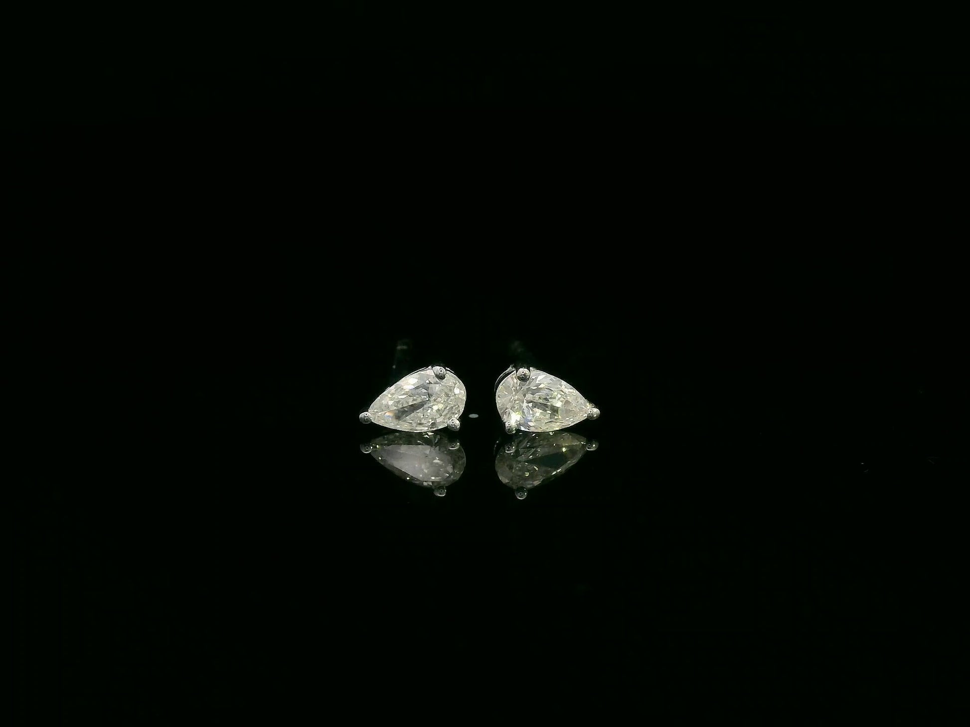 18K white gold pear cut diamond solitaire stud earrings with 0.37 carat diamonds by Emirates Diamonds