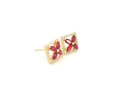 18K yellow gold square stud earrings with ruby cluster center and diamond halo by Emirates Diamonds.