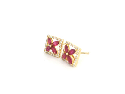 18K yellow gold square stud earrings with ruby cluster center and diamond halo by Emirates Diamonds.