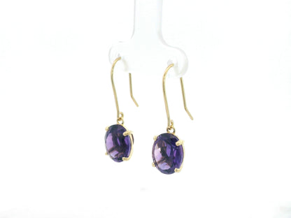 18K yellow gold amethyst drop earrings with oval-cut amethysts by Emirates Diamonds