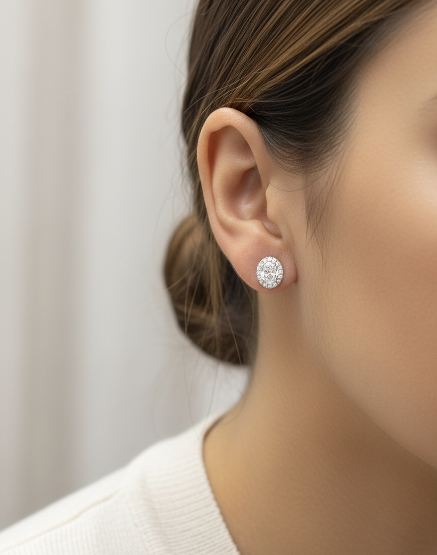 18K white gold oval cut diamond halo stud earrings with 1.40 carat GIA certified diamonds by Emirates Diamonds