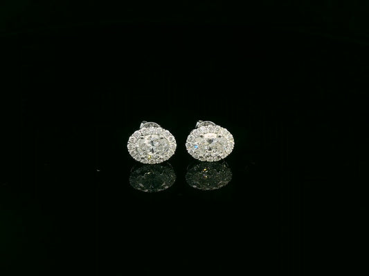 18K white gold oval cut diamond halo stud earrings with 1.40 carat GIA certified diamonds by Emirates Diamonds