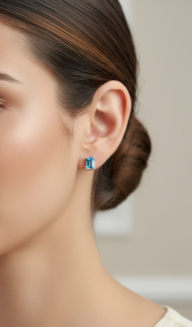 18K white gold emerald cut blue topaz stud earrings 2.44 carat by Emirates Diamonds