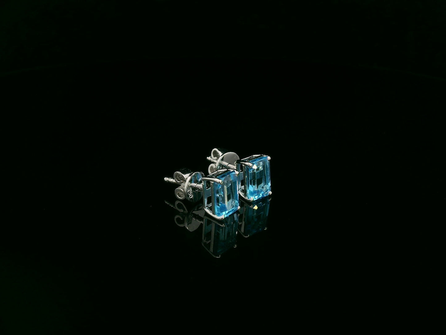 18K white gold emerald cut blue topaz stud earrings 2.44 carat by Emirates Diamonds