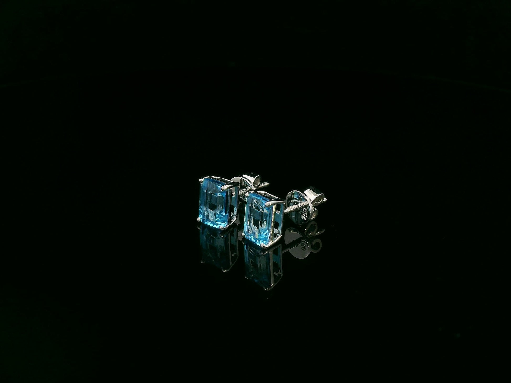 18K white gold emerald cut blue topaz stud earrings 2.44 carat by Emirates Diamonds