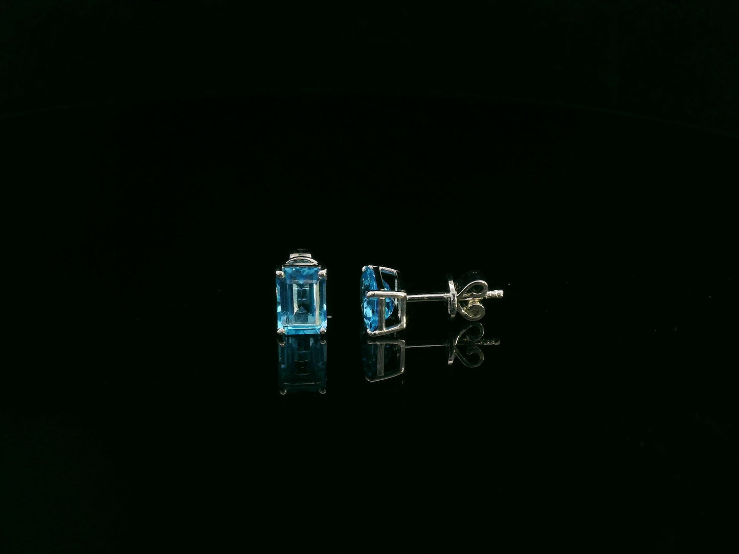 18K white gold emerald cut blue topaz stud earrings 2.44 carat by Emirates Diamonds