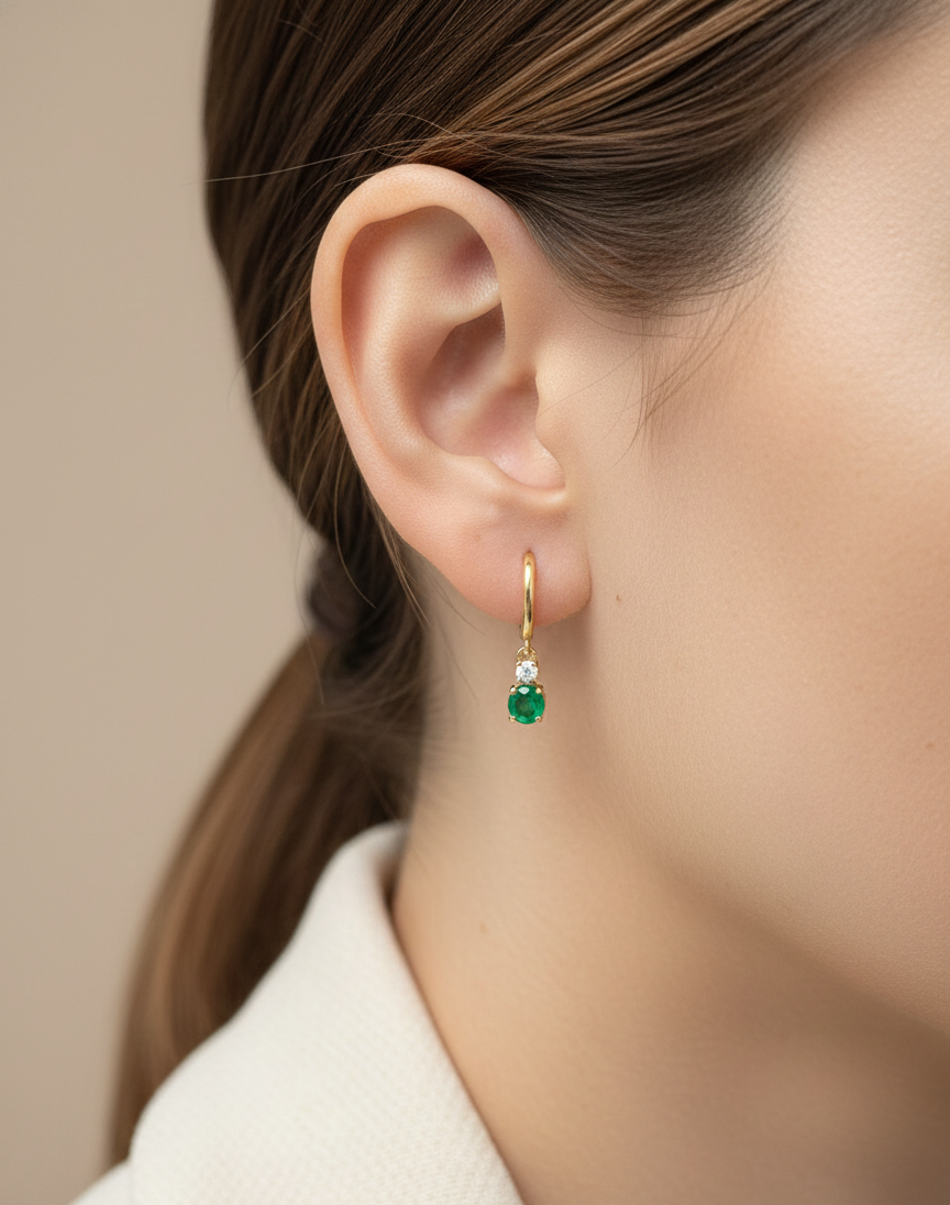 18K yellow gold emerald and diamond drop earrings by Emirates Diamonds