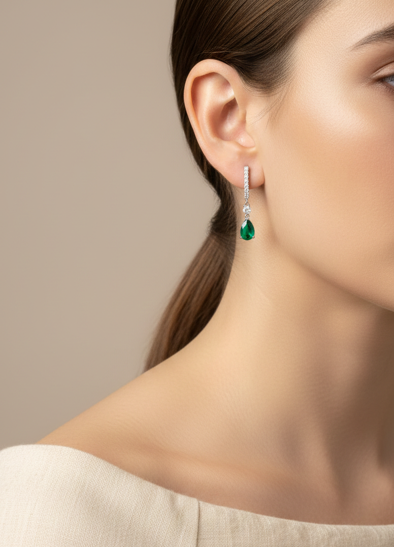 18K white gold emerald and diamond drop earrings with pear-shaped emeralds by Emirates Diamonds