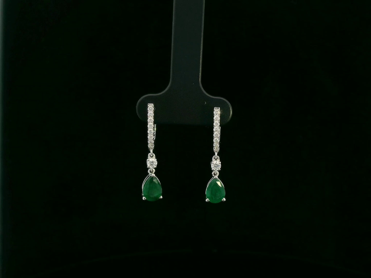 18K white gold emerald and diamond drop earrings with pear-shaped emeralds by Emirates Diamonds