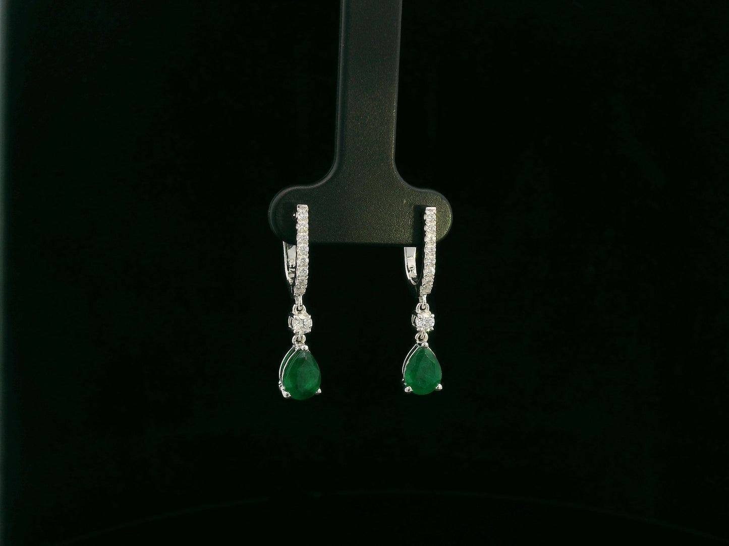 18K white gold emerald and diamond drop earrings with pear-shaped emeralds by Emirates Diamonds