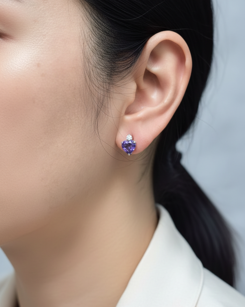 Heart-shaped tanzanite and diamond earrings in 18K white gold by Emirates Diamonds.