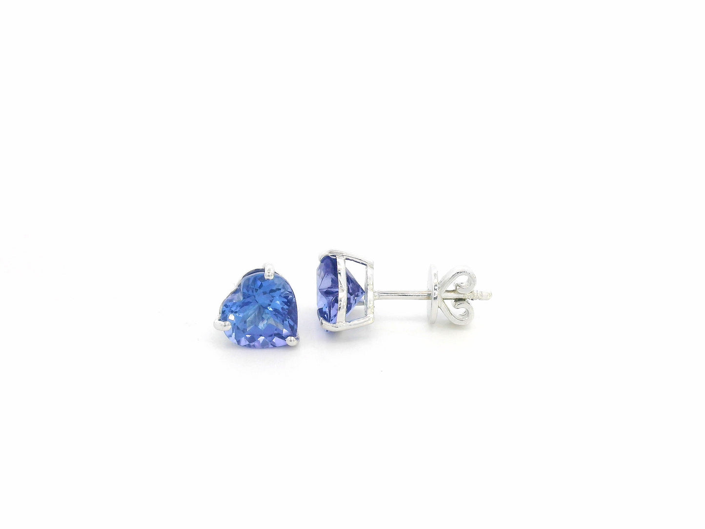 Heart-shaped tanzanite stud earrings in 18K white gold by Emirates Diamonds.