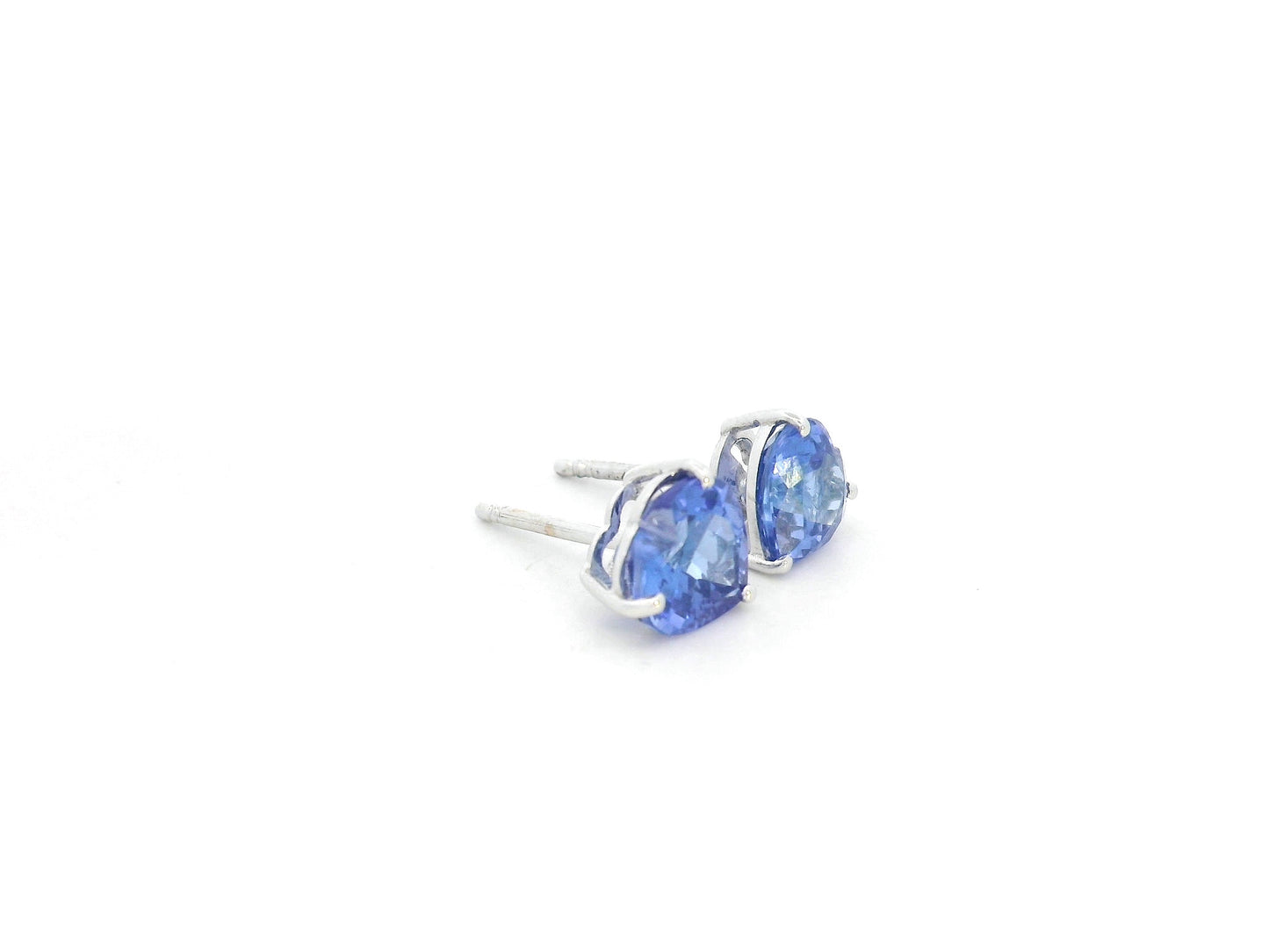 Heart-shaped tanzanite stud earrings in 18K white gold by Emirates Diamonds.