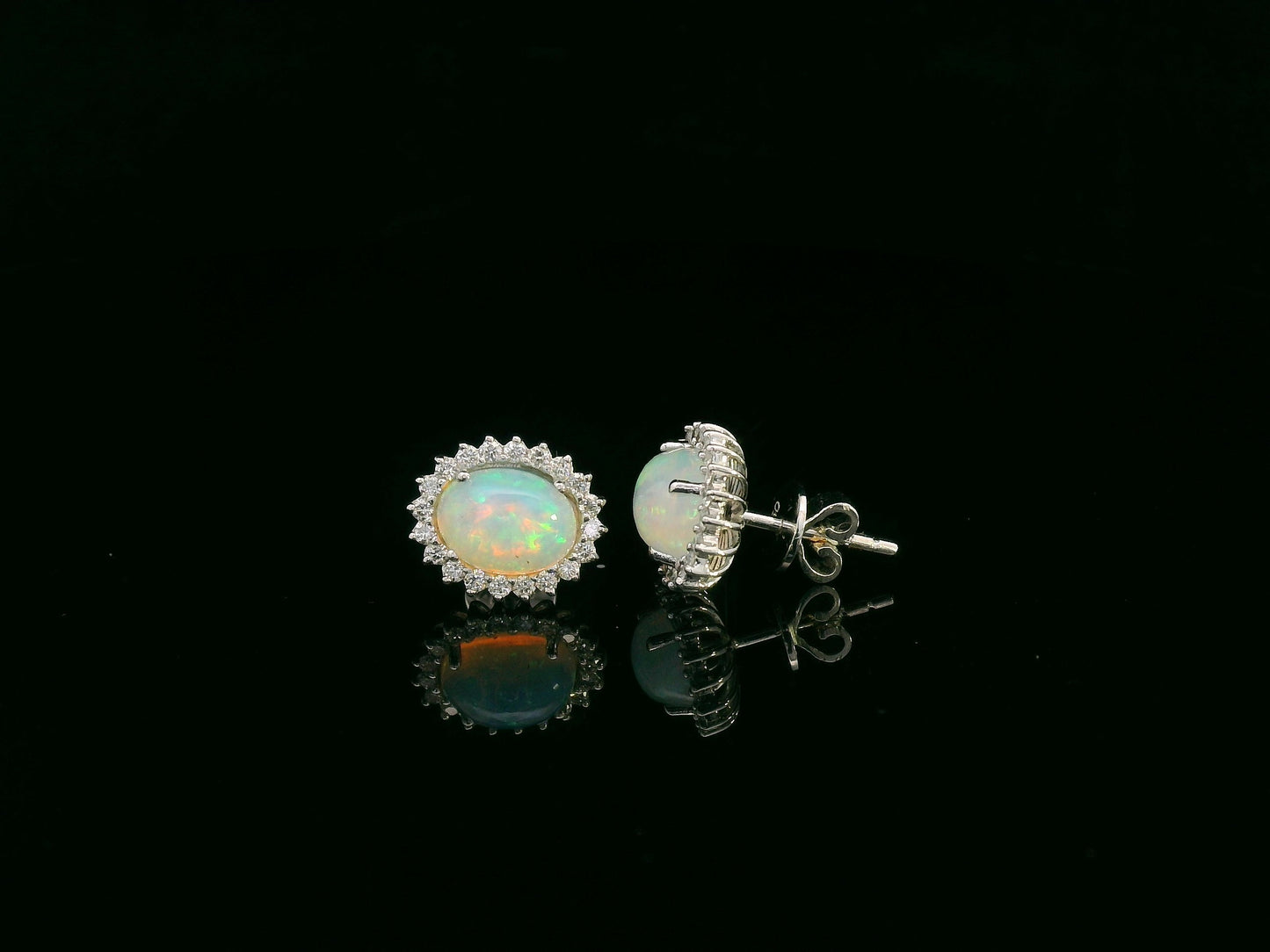 Opal and diamond halo stud earrings in 18K white gold by Emirates Diamonds.