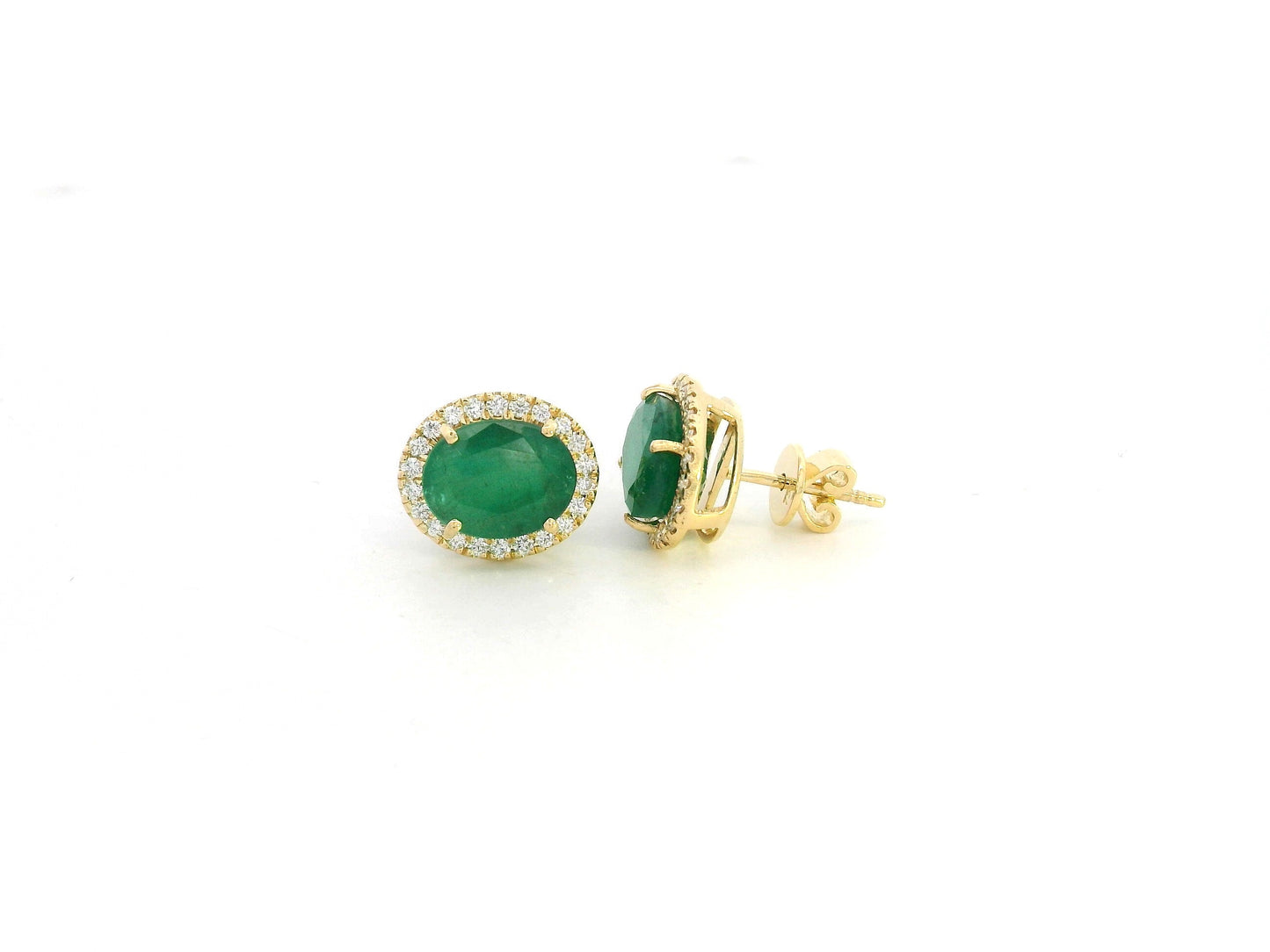 18K yellow gold emerald and diamond halo stud earrings with oval emeralds and brilliant diamond accents by Emirates Diamonds.